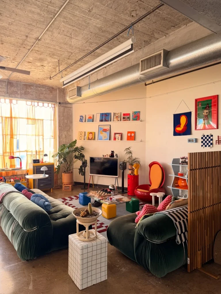 Colorful maximalist Toca Boca-inspired living room with dark green tufted sofas