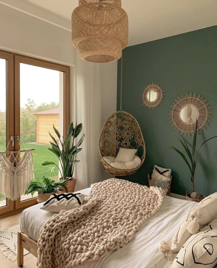 Boho bedroom with dark green accent wall