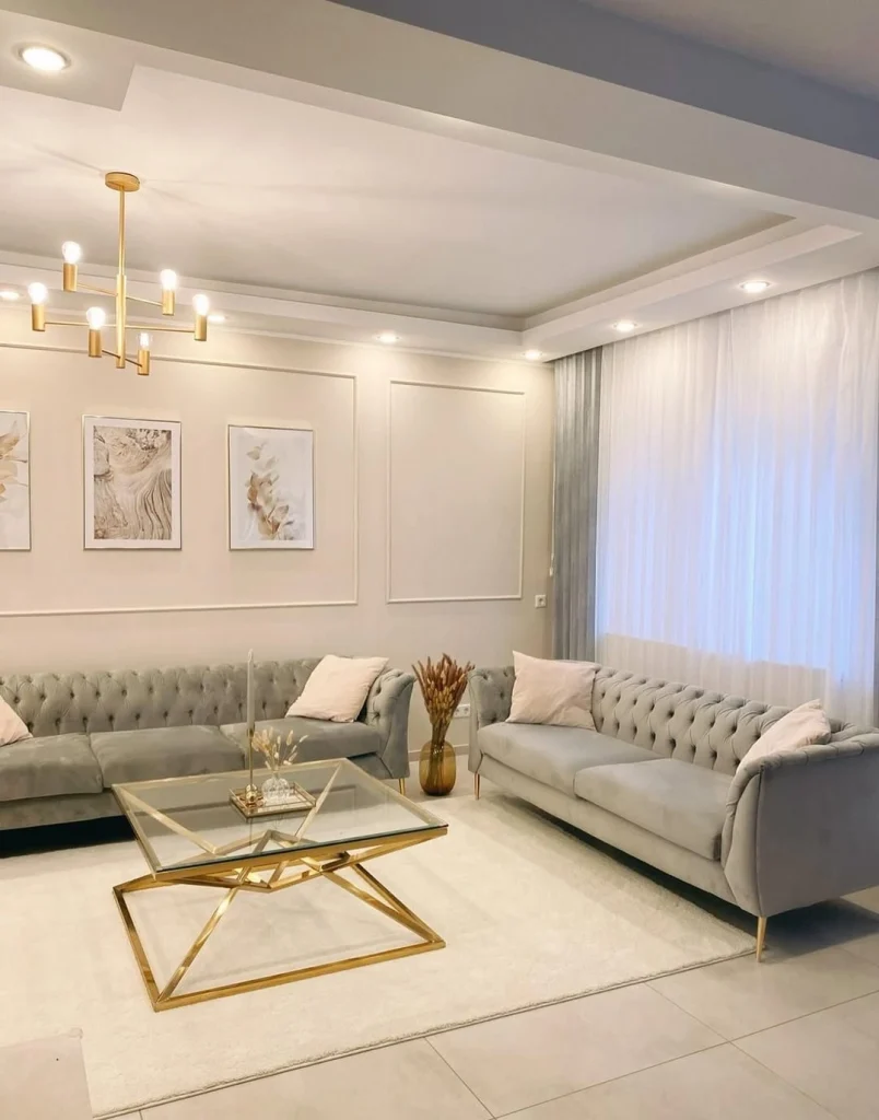 Glam living room with grey velvet Chesterfield sofas