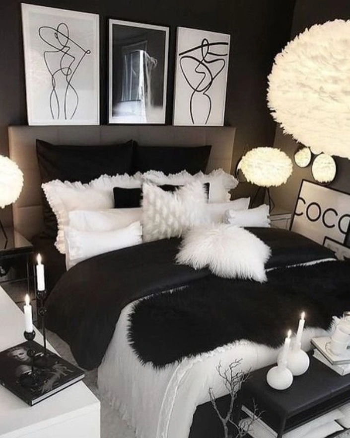 Maximalist black-wall bedroom with white feather pendant lights