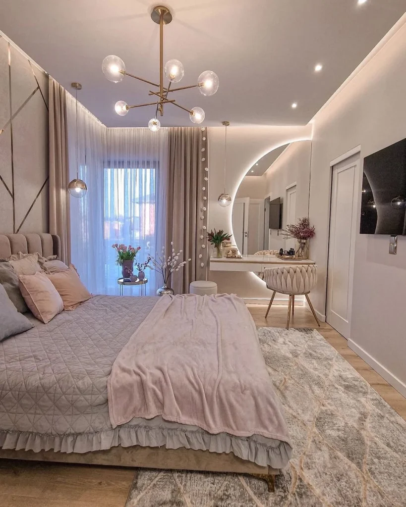 Glamorous couple's bedroom with gold multi-arm globe chandelier